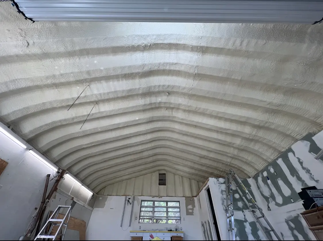 Spray polyurethane foam applied to the underside of a metal roof deck in Brentwood
